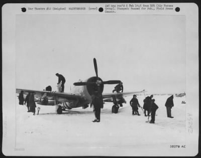 General > Belgium civilians at a 9th AF fighter base are cleaning the snow from the runway while IX AF Service Command mechanics service a Republic P-47 Thunderbolt before its take off against the enemy. This fighter-bomber is being used to bomb and strafe
