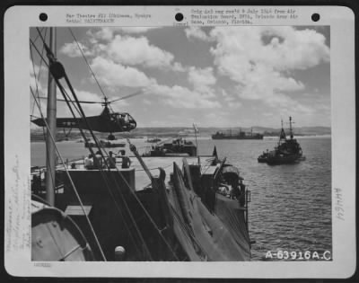 Thumbnail for Miscellaneous > One Of The Two Helicopters Of The Uss General Duncan, An Aircraft Repair Unit (Floating) Liberty Ship, Is Landing On Its Flight Deck After Making A Delivery Of Aircraft Parts That Were Repaired In The Machine Shop Of This Repair Ship.  The Helicopters Wer