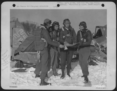 General > Col. Ray J. Stecker, Hazelton, Pa., commander of the 365th fighter-bomber group discuss a flight plan with three of his squadron commanders. In the background is a wrecked FW-190. Left to right: Lt. Col. George R. Brooking, Livingston, Mont.