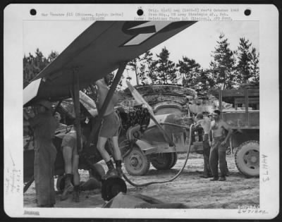 Thumbnail for Refueling > Maintenance Crew Fills The Fuel Tank Of The First Vultee L-5 To Be Re-Assembled At Cub Field No. 7 On Okinawa, Ryukyu Retto After Shipment From Hawaiian Islands.  This Plane Will Be Flown By The 163Rd Liaison Squadron Which Is Attached To The 10Th Army. 1