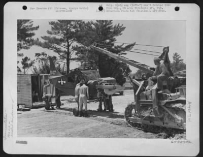 Thumbnail for Refueling > Ground Crew Fills The Fuel Tank Of The First Vultee L-5 Of The 163Rd Liaison Squadron, After It Was Re-Assembled At Cub Field No. 7; The Plane Had Been Dismantled And Crated At Schofield Barracks, Hawaii, For Shipment To This Base On Okinawa, Ryukyu Retto