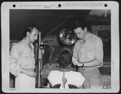 Thumbnail for Clinicaltreatment > Capt. Lewison, Dentist, And Cpl Harvey Fuerst, Assistant, Are Shown At The 389Th Air Service Group Dental Clinic, Kadena Airfield, Okinawa, Ryukyu Retto.   20 September 1945.