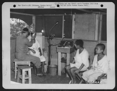 Thumbnail for Clinicaltreatment > A Native Okinawan Who Is Suffering From An Eye Infection Is Treated In The Ear, Eye, Nose And Throat Clinic Of The American Military Government Hospital On Okinawa, Ryukyu Retto.  Some Of His Countrymen Await Their Turn For Medical Attention.  15 June 194