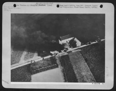 General > 8th Air force fighter planes swept down to tree-top level and strafed a column of German oil tank trucks on a highway in Belgium during one of their many recent attacks on Nazi transport. Five of the vehicles may be seen burning fiercely here.