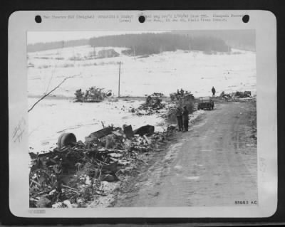 General > How tactical air power helped to halt von Rundstedt's counter-offensive is exemplified by this photo of a German convoy wrecked by Ninth Air force fighter-bombers during recent fighting in the Houffalize area. A dozen vehicles, including a Sherman