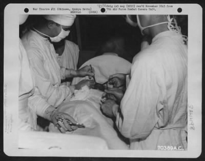 Thumbnail for Hospital Patients > An Okinawan Native Undergoes A Tumor Operation In The Operating Room Of The American Military Government Hospital On Okinawa, Ryukyu Retto.  All The Patients Are Natives Of The Island.  15 June 1945.