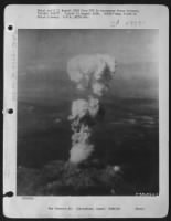 Atomic Burst.  At The Time This Photo Was Made, Smoke Billowed 20,000 Feet Above Hiroshima While Smoke From The Burst Of The First Atomic Bomb Had Spread Over 10,000 Feet On The Target At The Base Of The Rising Column.  August 5, 1945.  Two Planes Of The - Page 1