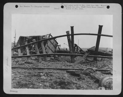 General > Railroad cars, rails and roadbeds smashed and ripped by 9th AF fighter-bombers during an attack on an enemy railroad yard along the Belgian-German borders as part of a coordinated plan to snarl German railroad communications by the three Tactical Air