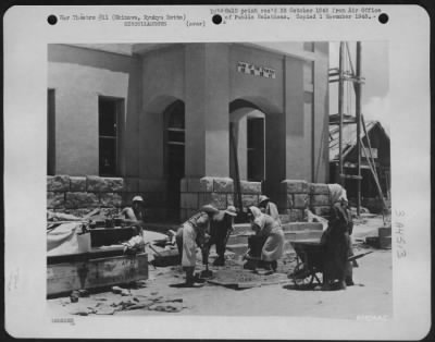 Thumbnail for General > Bank Building First In Naha To Rise From Rubble - Native Okinawans Are Shown Putting The Finishing Touches To The Stone And Concrete Building, The Bank Of The Ryukyus -- First Of Naha'S Prewar Business Enterprises To Rise From The Rubble Caused By The Bom