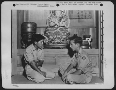 Thumbnail for General > Airman Hears Story Of Goddess Of Mercy - Sergeant Phil C. Geraci, Of Frederck, Maryland, A Photographer Assigned To The 1St Air Division, Sits In Front Of A Buddhist Temple In The Ishikawa Exhibit House And Listens While An Okinawan Guide Explains That Th