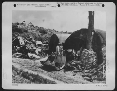 Thumbnail for General > Aircraft Scrap Utilized By Okinawans - This Crude-Looking Plant Located Near The Ancient City Of Shuri Is In Full Production As One Of Okinawa'S Rising Young Industries In The Manufacture Of Aluminum Pots, Pans, Getas (Shoes) And Other Usable Objects Whic