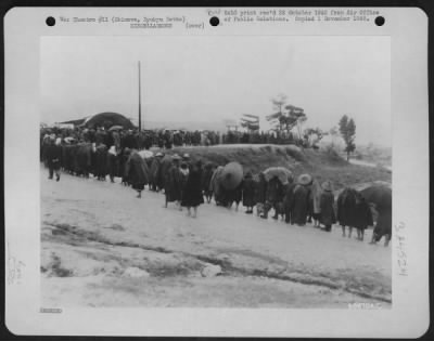 Thumbnail for General > Inclement Weather Doesn'T Stop Native Workers - These Natives Are Lined Up To Cast Their Votes For Village Mayor And Other Officials On Okinawa, Ryukyu Retto.