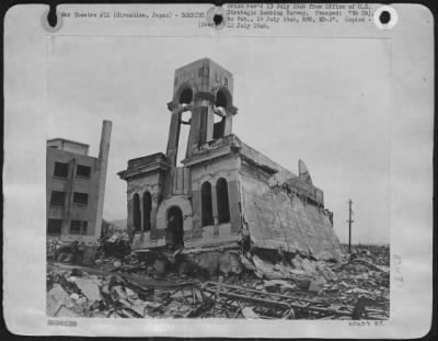 Hiroshima > This Steel Frame Building (The Shimoumuna Watch Shop), 2,000 Feet From Ground Zero At  Hiroshima, Japan, Has Its First Story Columns Buckle Away From The Atomic Bomb Blast, Dropping The Second Story To The Ground.  Combustibles Were Destroyed By Fire. (Ne