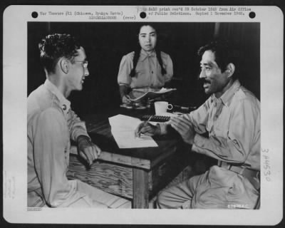 Thumbnail for General > An Elected Mayor Has His Say About Democracy - Seizen Shiroma, Right, Mayor Of Koza Village In North Central Okinawa, Ryukyu Retto, Explains To Private First Class Victor Fousel, Of Bowie, Arizona, A Radio Operator On A Boeing B-29 "Superfortress", Some O