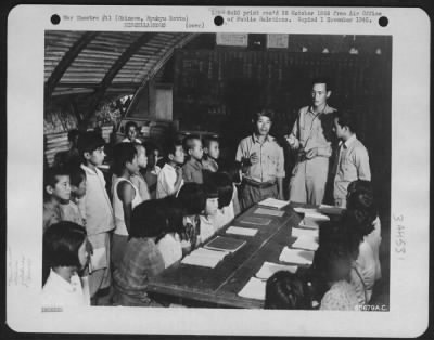 Thumbnail for General > Airman Is Guest Teacher At Okinawan Grammar School - Grammar School Children In A Typical Okinawa Classroom In The Village Of Koza Are Shown Listening To A Guest Teacher.  Private First Class Victor Fousel, Of Bowie, Arizona, Who Is Explaining Through An