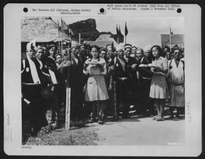 Thumbnail for General > To The Victor Belongs The Spoils - In This Case It'S Food -- Native Okinawan Vegetables Being Served On Metal Trays By Stoic-Faced Native Girls To The Boatmen Who Proved Themselves Victorious In The Annual Regatta Near Machinato Village On The China Sea.