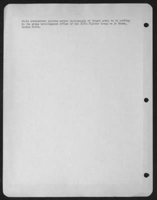 General > Photo Interpreter Studies Aerial Photographs Of Target Area; He Is Working In The Group Intelligence Office Of The 318Th Fighter Group On Ie Shima, Ryukyu Retto.