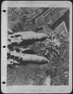 Ghent > Almost hiding the target from view, bombs from attacking U.S. 8th AAF heavy bombers plunge toward the rail marshalling yards at Ghent, Belgium, during the 22 June 44 attack.