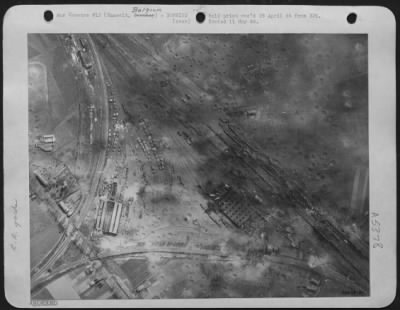 Hasselt > The destruction caused on this Nazi supply junction Raliway yards at Hasselt by B-26 Marauders of the 9th A.F. in Easter week may be seen clearly on this photo. It shows very many bomb craters, one of which is 150 ft. long by 40 ft. wide causing