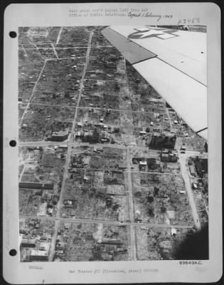 Hiroshima > Pacific Air Command, U.S. Army - 3 August 1946 - An Aerial View Of Hiroshima, Japan On Year After It Was Hit By The First Atomic Bomb To Be Dropped By The Army Air Forces Shows Only A Few New Houses Being Erected On The Scorched Earth In The Center Of The