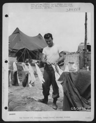 General > An American 'Gi' Takes Time Out From His Duties To Take Care Of His Personal Laundry.  Okinawa, Ryukyu Retto, 1945.