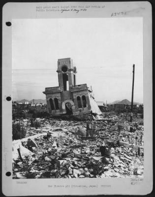 Hiroshima > One Year After The Dropping Of The First Atom Bomb, Hiroshima, Japan, Is Still A Town Of Rubble And Debris.  This Steel Frame Building (The Shimomuna Watch Shop) Had Its First Story Columns Buckle Away From The Terrific Forces Of The Blast, Dropping The S