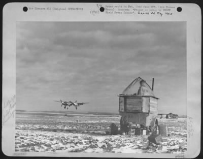 General > Lockheed P-38 Fighter-Bomber Of The 9Th Af Coming In For A Landing At A Forward Airfield In Belgium.  Flying Control 'Tower' In The Foreground Discloses The Mobility Prevalent In The 9Th Af, Which Enables Airfield Installations To Set Up For Immediate Ope