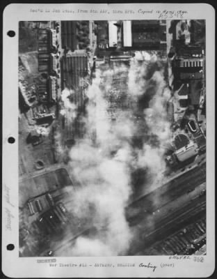 Thumbnail for Antwerp > The Aircraft Assembly Shop - 300 X 380 Ft - Of The Erla Aircraft Works, Antwerp, Belgium, Still Burning Some Hours After It Was Attacked By Heavy Bombers Of The Us Aaf In Daylight On 5 April 1943.  The Building Was Heavily Damaged, As Was The Adjoining Ai