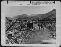 At Nagasaki, Japan Only Rubble Remains Near The Point Where The Atomic Bomb Was Dropped.  Nagasaki Was So Pulverized That Only A Few Shacks Could Be Rebuilt Out Of Debris. - Page 1