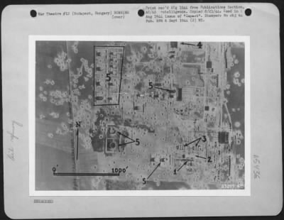 Thumbnail for Budapest > Szony Refinery, Budapest, Hungary after attack of 14 June 1944. Reconnaissance photo shows distillation unit (1), pump house (2), running tanks (3) damaged. Unidentified building (4) got direct hit. Storage tanks (5) are damaged. Stain on ground is