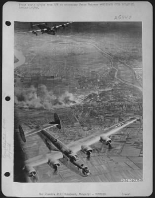 Budapest > These are Consolidated B-24 Liberators of Maj. Gen. Nathan F. Twining's U.S. Army 15th Air force, seen during their bombing of the Nazi-held Budapest/Tokal airdrome in Hungary.