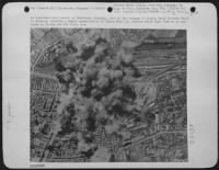 An important rail center in Debreczen, Hungary, used by the Germans to supply their Eastern front in Rumania, receives a heavy concentration of bombs from U.S. Bombers which then flew on to new bases in Russia for the first time. - Page 1