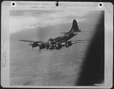 General > HUNGARY--After completing it's bomb run over Budapest Farencvaros Railroad yards on 14 July 1944, this Boeing B-17 Flying ofrtress was the victim of a direct hit by flak. Five of the crew were seen to have bailed out, and the plane crashed