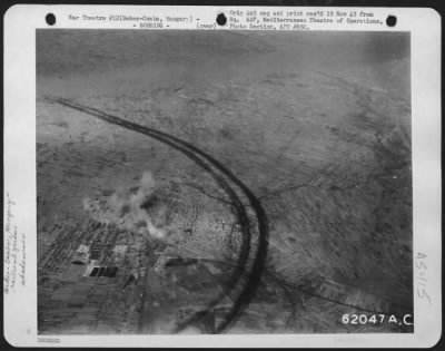 Thumbnail for Bekescsaba > Bombing Of Marshalling Yards At Bekes Csaba, Hungary, By Boeing B-17 'Flying Fortresses' Of The 15Th Air Force, On 22 September 1944.  Note Shadow Of Vapor Trails, Left By The Departing 'Fortresses', Circling The Target.