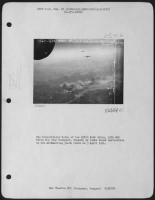 Budapest > Two Consolidated B-24S Of The 456Th Bomb Group, 15Th Air Force Fly Over Budapest, Hungary As Bombs Wreak Destruction On The Marshalling Yards There On 3 April 1944.