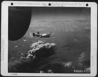 Thumbnail for Budapest > A Consolidated B-24 Liberator Of The 15Th Air Force Flies Over The Smoke-Covered Target At Budapest, Hungary.