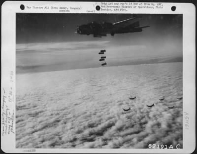 Novezamky > Bombs Away!  A String Of Bombs Is Released By A Boeing B-17 "Flying Fortress", Part Of A Formation Attacking Enemy Installations At Nove Zamky, Hungary On 7 October 1944.