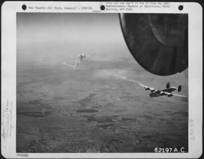 Szob > Bombing Of Railroad Bridge Near Szob, Hungary By Consolidated B-24 "Liberators" Of The 15Th Air Force On 18 September 1944.  Smoke Curls High Into The Air As This 'Liberator' Heads For Home.