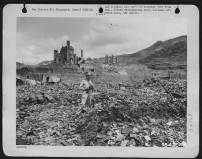 Nagasaki > 1St Lt. D.A. Mcgovern, Buffalo, N.Y., Usaf, Member Of The Newsreel Pool, Stands At Exact Spot Where The Atomic Bomb Dropped At Nagasaki, Japan.  This Spot Is Now Called "Zero".  In The Distant Background May Be Seen The Urakami Cathedral.  8 September 194