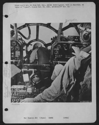 Thumbnail for General > Japan - Beginning Bomb Run, Pilot Switches On Automatic Pilot, While Bombardier (Center) Adjusts Sights In A B-29 Superfortress.