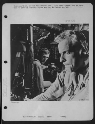 Thumbnail for General > Sweating Out Gas On A Return Trip From Japan, This Tight-Lipped B-29 Commander Is Watched By His Flight Engineer In The Background.