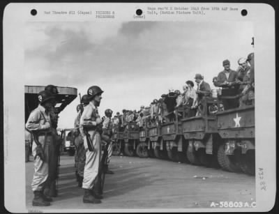 Thumbnail for General > Released Prisoners Of War Climbing On Trucks At Yokohama Station, Japan, To Go To Dock Area And Aboard Hospital Ship.  September 1945.