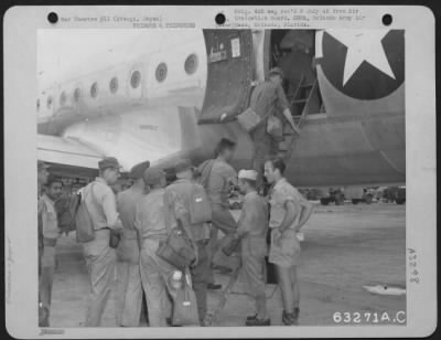 Thumbnail for General > A Crew Member Of A Douglas C-54 Checks His Passenger List As Prisoners' Of War Board The Plane.  Atsugi, Japan, 8 September 1945.