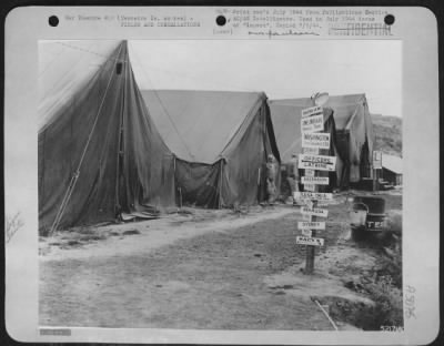 Thumbnail for General > Signpost reminds visiting U.S. officers who are billeted in these tents that Lagens Field, Terceira Island, Azores is at the crossroads of the universe.