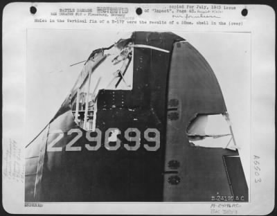 Battle Damage > Holes in the Vertical fin of a B-17F were the results of a 20mm. Shell in the shipyard attack at Flensburg, May 19.