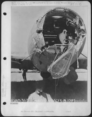 Battle Damage > Nose damage to Boeing B-17 Flying ofrtress named "Old Bill". Damage caused by 20 MM shell (5/15/43.)