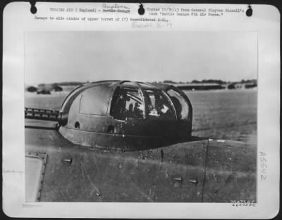 Battle Damage > Damage to side window of upper turret of (?) Boeing B-17.