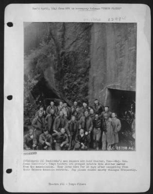 General > Doolittle's men require Air Raid Shelter, Too---Maj. Gen. James Doolittle's Tokyo raiders are grouped outside this shelter carved from the mountainside. They lives here for 10 days after assembling from their Chinese Mountain retreats.