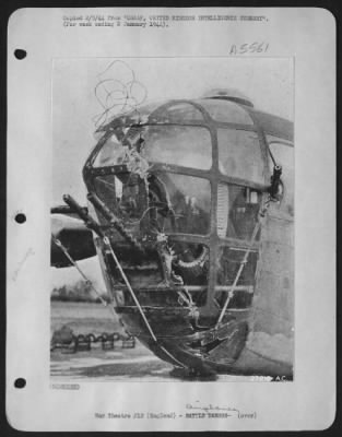 Battle Damage > This photo shows about 100-feet of German cable entwined in the nose of a USAAF Consolidated B-24 after the mission to Emden, Germany, 11 Dec. 1943. German fighters appear to be experimenting with lengths of such cable, from which bombs
