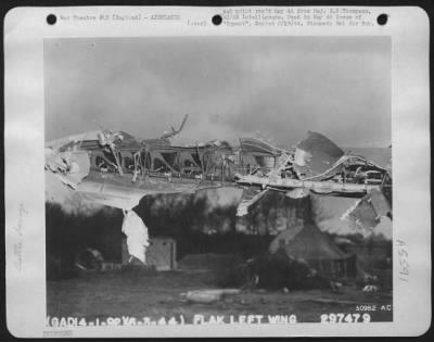 Thumbnail for Battle Damage > Wing of a Boeing B-17G, the trailing edge is shown ripping by a direct large caliber antiaircraft hit over Berlin on 6 March 44. Although 24 inches of the left aileron, including the trim tab, was destroyed, the Tokio tanks and control cables were